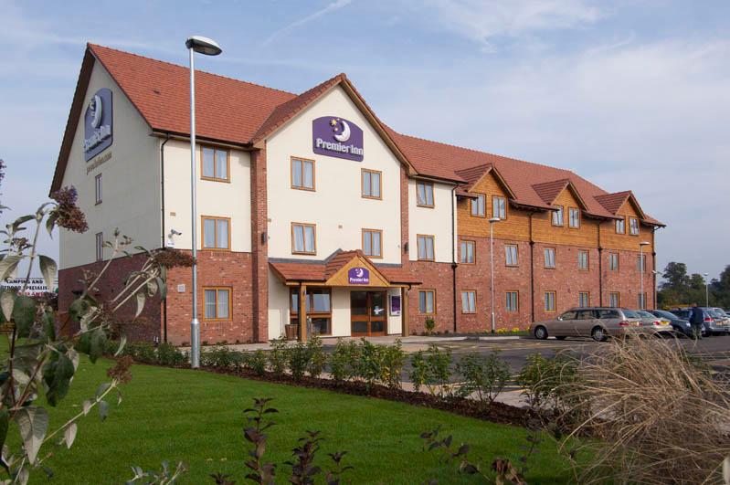 Exterior at Premier Inn Newport/Telford hotel showing surrounding gardens