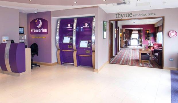 Reception area leading into Thyme restaurant inside Premier Inn Camberley hotel