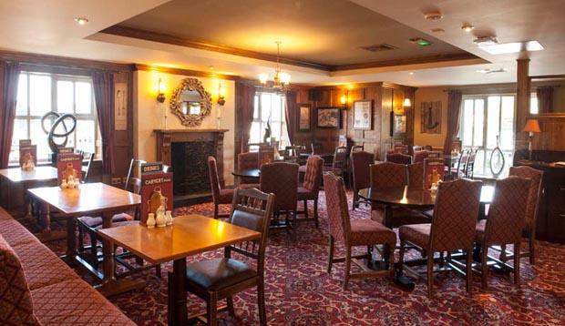 Inside restaurant at Premier Inn Gosport showing seating area