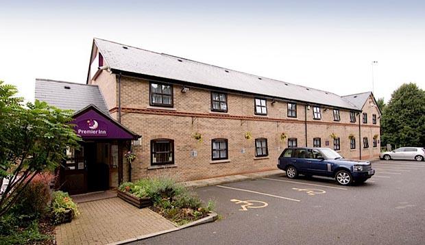 Exterior of Premier Inn Leicester North West hotel showing car park