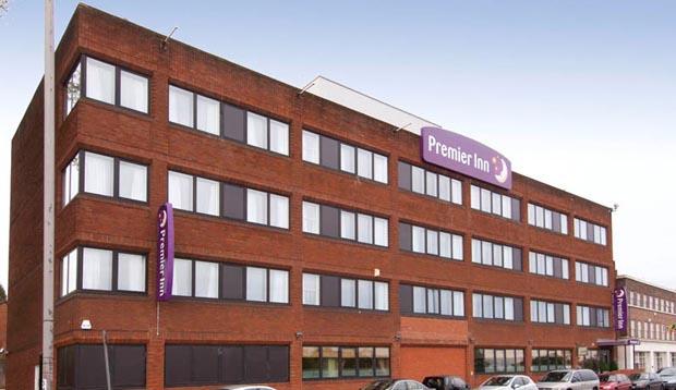 Exterior of Premier Inn London Hanger Lane showing car park