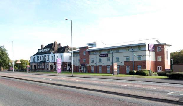 Exterior of Premier Inn Manchester (Heaton Park) hotel with street view