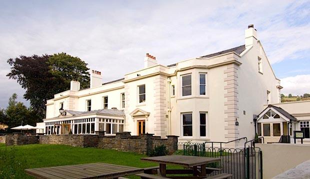 Exterior at Premier Inn Merthyr Tydfil hotel showing gardens