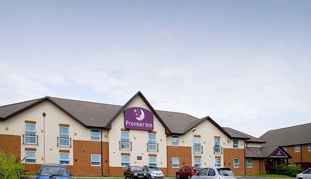 Exterior at Premier Inn Norwich Airport showing car park